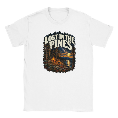 Lost In The Pines - T-shirt in White. A tent among tall pines beside a moonlit lake and starry sky beneath Lost in the Pines lettering.