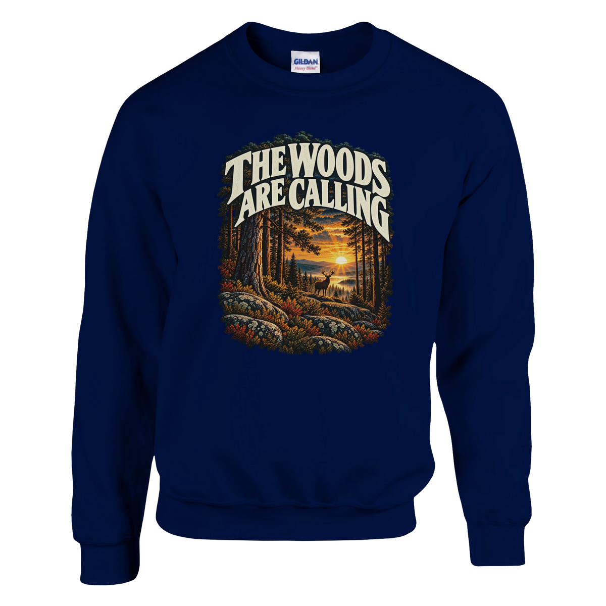 The Woods Are Calling - Sweatshirt in Navy. A deer between tall pine trees in golden light beneath The Woods Are Calling lettering.