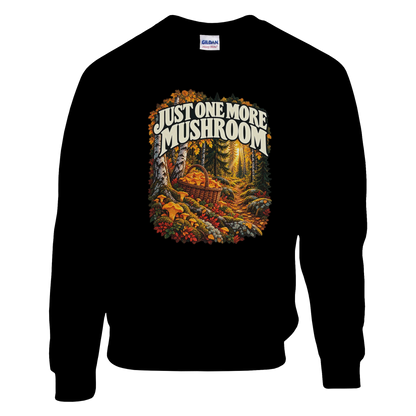 Just One More Mushroom - Sweatshirt in Black. Golden mushrooms in a wicker basket on a mossy forest floor beneath Just One More Mushroom lettering.