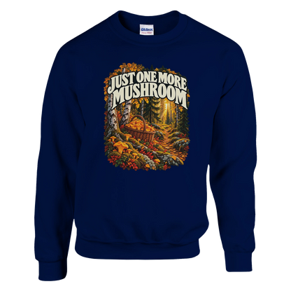 Just One More Mushroom - Sweatshirt in Navy. Golden mushrooms in a wicker basket on a mossy forest floor beneath Just One More Mushroom lettering.