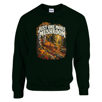 Just One More Mushroom - Sweatshirt in Forest Green. Golden mushrooms in a wicker basket on a mossy forest floor beneath Just One More Mushroom lettering.
