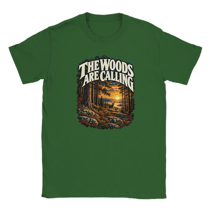 The Woods Are Calling - T-shirt in Military Green. A deer between tall pine trees in golden light beneath The Woods Are Calling lettering.